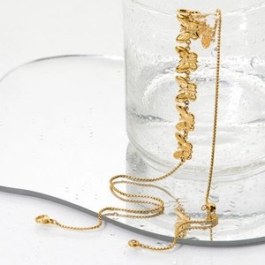 Adjustable stainless steel butterfly necklace with gold-plated hollow charms on glass rim