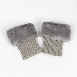 Macro detail of faux fur trim and ribbed knit texture on these gray leg warmers