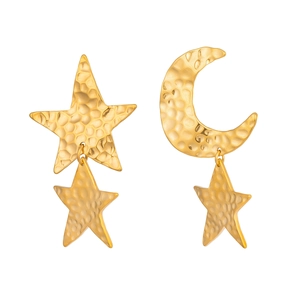 Detailed view of asymmetric star and moon earrings with hammered gold texture finish