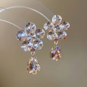Sparkling silver needle flower drop earrings with waterdrop crystal pendants in gold