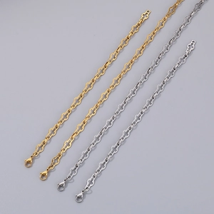 Detailed view of silver and gold stainless steel hollow link chains with lobster clasps