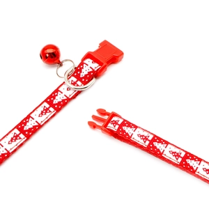 Christmas pet collar in festive red with snowflake prints and a small metal bell