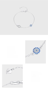 Macro detail of S925 sterling silver Hamsa hand and evil eye bracelet with pavé stones