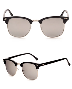 Detail view of retro half-frame sunglasses with black upper frame and silver bridge