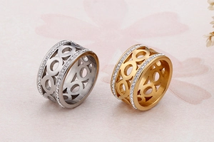 Close-up of gold and silver hollow titanium rings with double row pavé zircon stones