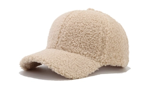 Detailed close-up of beige fleece baseball cap showing soft teddy velvet texture