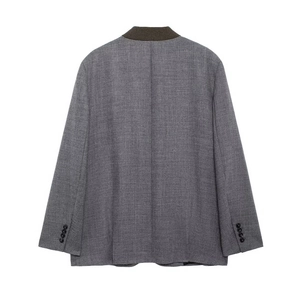 Detailed back view of a grey blazer with dark brown contrast collar and twill texture