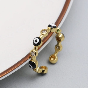 Macro detail of adjustable evil eye ring with gold plating and cubic zirconia inlay