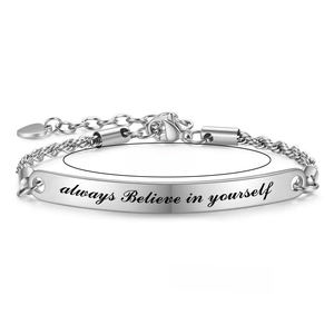 Detail of silver stainless steel bracelet with engraved inspirational text and size labels