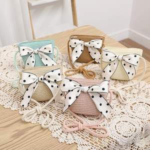 Mini straw crossbody bags with polka dot bows in five pastel colors for summer beach