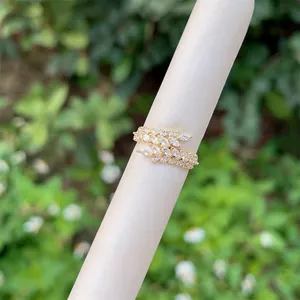 Detailed view of adjustable 18K gold plated wheat leaf ring with sparkling zircons