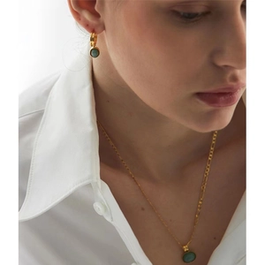 Model wearing luxury gold green aventurine earrings and necklace set with Figaro chain