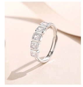 Macro shot of silver S925 ring featuring five rectangular cut cubic zirconia stones