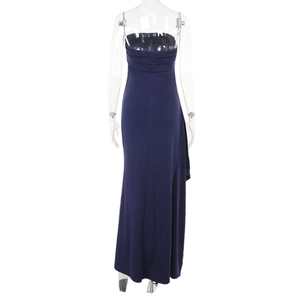 Detail of navy blue knitted dress showing thin straps and ruched back design