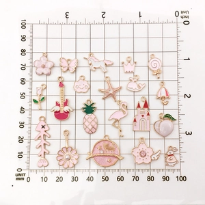 Pink and gold alloy charms set featuring flowers and animals on a measuring grid