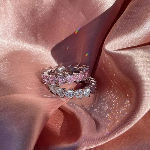 S925 sterling silver ring featuring pink heart zircon and sparkling side stones