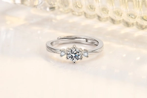 Macro shot of silver adjustable engagement ring with round zircon and wheat pattern