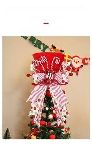 Detail of red velvet Christmas tree topper hat with bow and collapsible spring feature