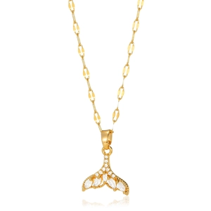Close-up of golden whale tail pendant set with sparkling white zircon crystals