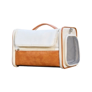 Portable pet carrier bag in beige canvas and brown leather with mesh window ventilation