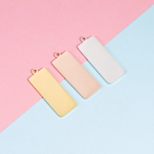 Polished rectangular stainless steel pendants in gold, rose gold, and silver finishes