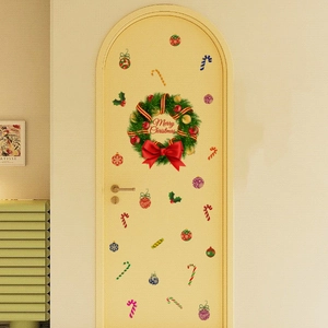 Detail showing self-adhesive Christmas wreath wall decals and candy cane stickers on a door