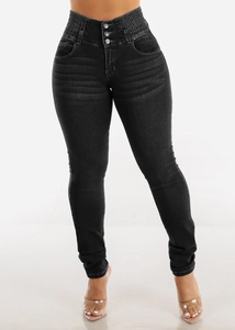Detail view of high waisted black skinny jeans with elastic triple button closure design