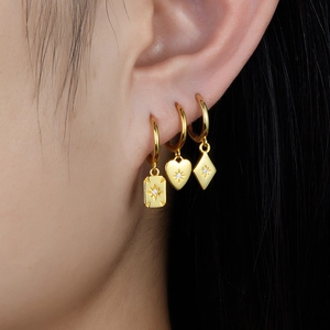Elegant gold S925 silver earrings with heart and geometric starburst charms for women