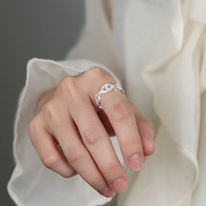 Minimalist S925 sterling silver pig nose link ring worn on index finger with open band