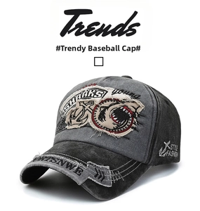 Detail of washed cotton baseball cap with shark embroidery and distressed brim edge