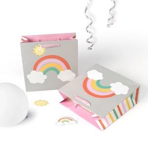Grey paper gift bag with cute rainbow and cloud patterns and pink satin handles