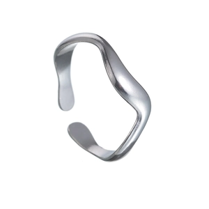 Macro detail of silver tone stainless steel ring with dynamic wavy water ripple design