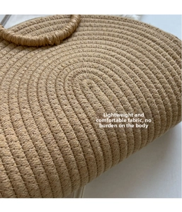 Close-up of the spiral woven texture and natural straw material of this vintage tote bag