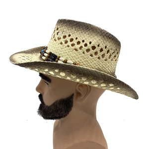 Detail of hand-woven straw cowboy hat with gradient edges and beaded decorative band