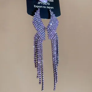 Sparkling purple rhinestone tassel wing earrings for women with silver needle studs