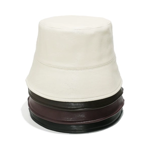 Close-up of PU leather bucket hats in white, brown, burgundy, and black with lychee texture