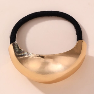 Detail of the high-elastic black hair tie with a polished gold crescent metal accent