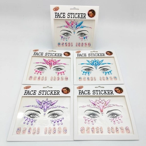 Macro view of five sets of colorful face sticker sets with sparkling rhinestones for music festivals