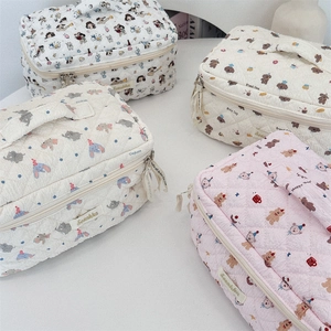 Quilted cotton cosmetic bags with cute cartoon prints and sturdy top handles for travel