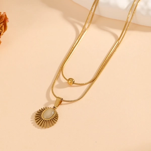 Double-layered gold snake chain necklace with sunburst opal pendant and metal bead