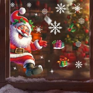 Christmas window decals with Santa Claus and snowflakes on a snowy glass window