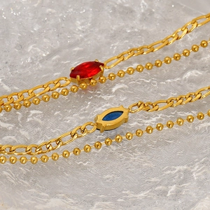 Double-layered gold titanium steel bracelet with red and blue marquise-cut zircon stones
