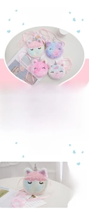 Detail of colorful unicorn plush purses showing zipper closure and pink shoulder strap