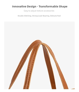 Detail of reinforced double stitching on brown leather tote bag handle for extra durability