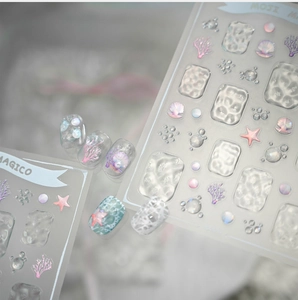 Macro view of 3D embossed ocean nail stickers with 3D starfish and coral textures