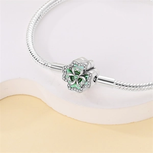 Silver four-leaf clover charm with green enamel and sparkling stones for DIY bracelets