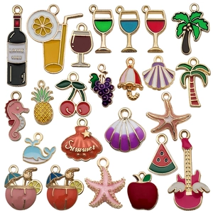 Colorful summer themed enamel charms with assorted cocktail and fruit shapes on white background