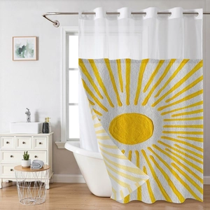 Detail of waffle weave shower curtain with metal rings and yellow sunburst pattern