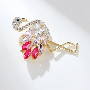 Close-up of flamingo brooch featuring pink marquise-cut crystals and sparkling rhinestones