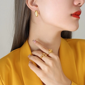 Minimalist 18K gold plated rice grain studs and rose ring set on female model